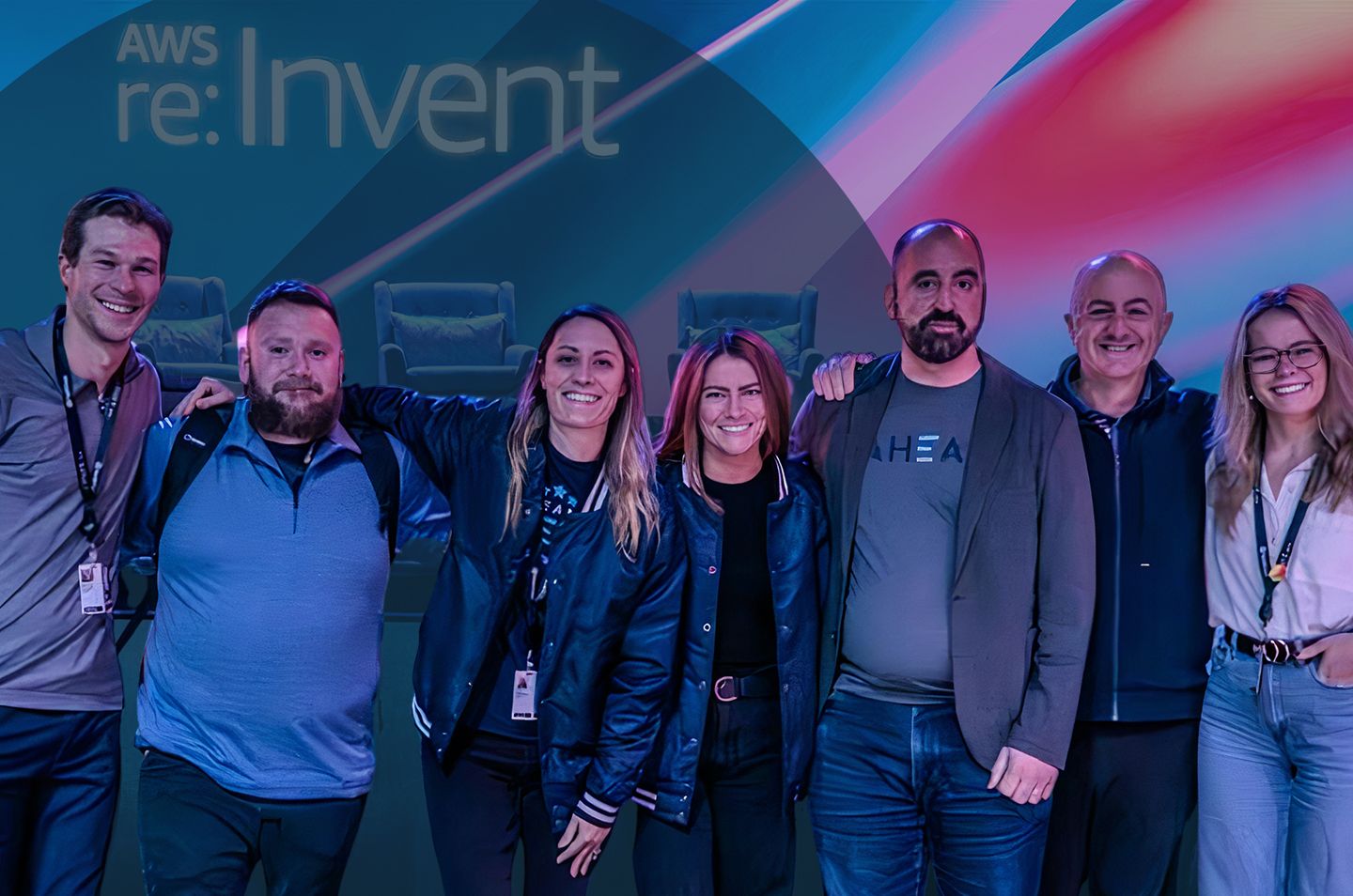 a group of people posing for a photo on stage