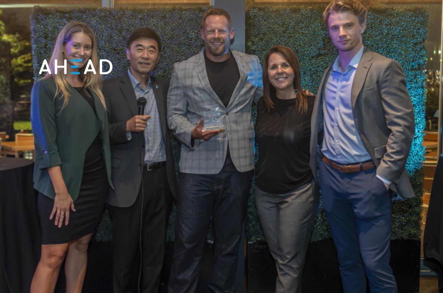 people posing for a group photoshoot at an event
