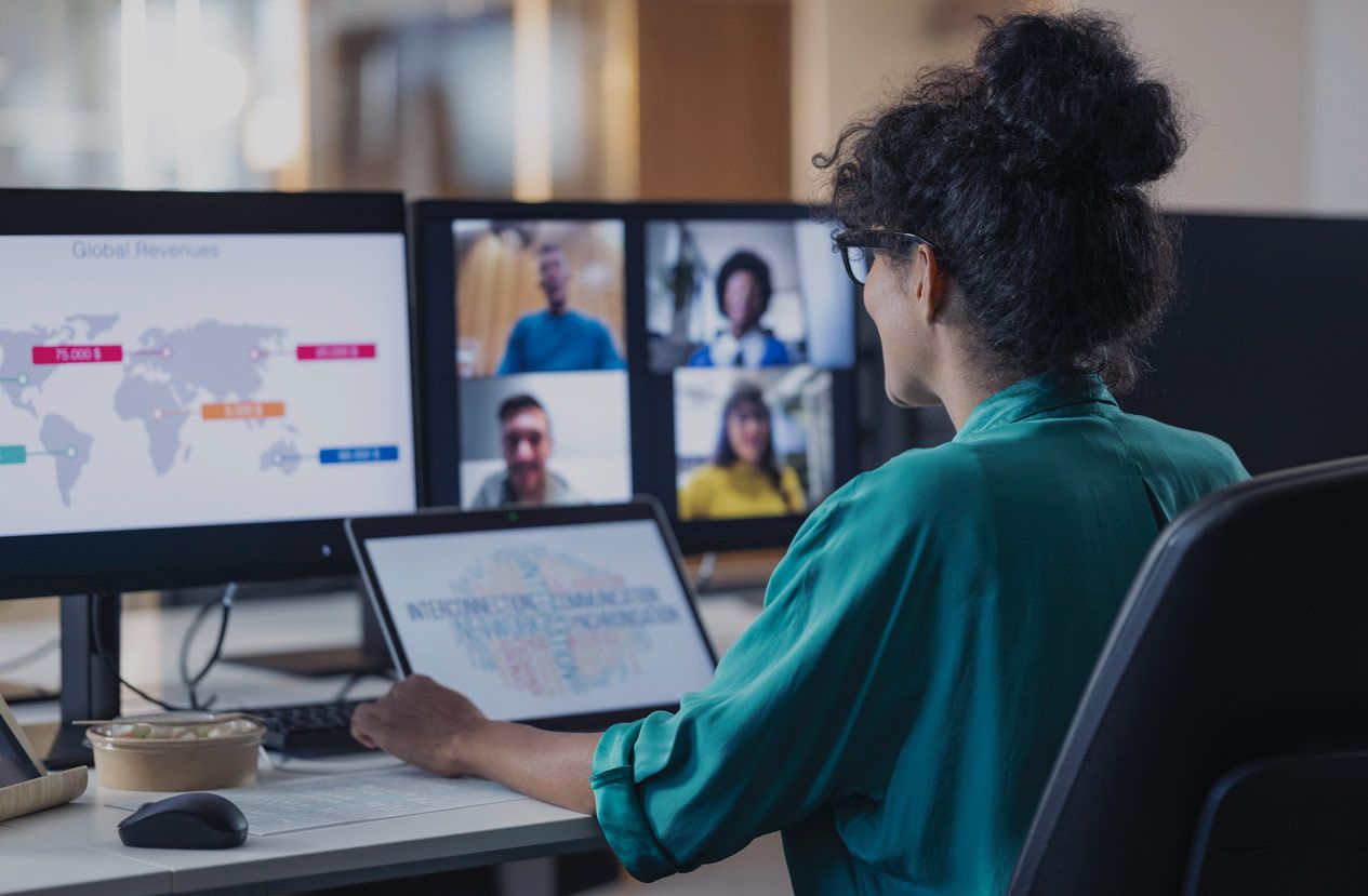 woman looking at tablet charts while on a video call
